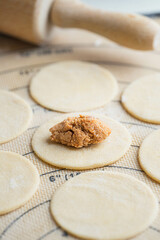 Ukrainian traditional food varenyky. varenyky with fried cabbage and meat. pierogi. Process of making Ukrainian food. raw food