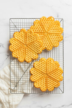Scandinavian heart-shaped waffles with jam and fruits. Norwegian waffles