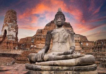 Buddha statue antiquities, Ruined of Buddha image, ayutthaya temple thailand, evening light.	