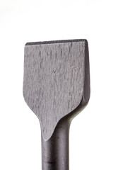 chipping chisel for rotary hammer,  for Concrete, flat chisel drill heads for perforators close-up with textured metal on a white background with sds plus