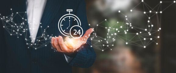Clock 24h service and people icon Concept, Businessman hand holding clock and line people icon, time management and business work planning, idea and concept of the schedule of the daily routine,