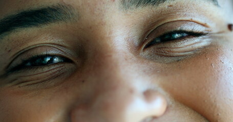 Macro close-up black person eyes looking at camera