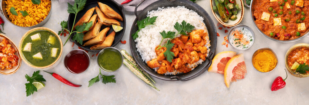 Indian food assortment on light background.