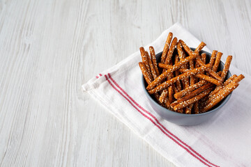 Baked Pretzel Sesame Sticks in a Bowl, low angle view. Copy space.