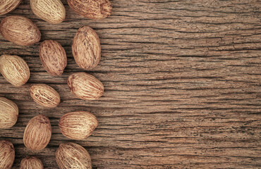 Old wood, vintage background with walnut kernels with copyspace, Top view with copy space. dried seeds, props. 