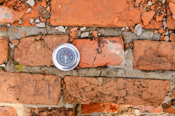 Compass background old, destroyed brickwork.