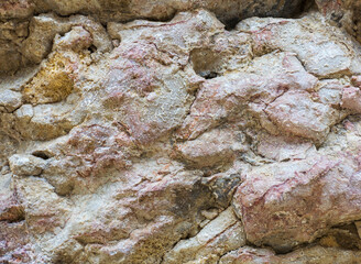 Natural mountain stone, the texture of the site, the walls of a stone canyon in a mountainous area.*