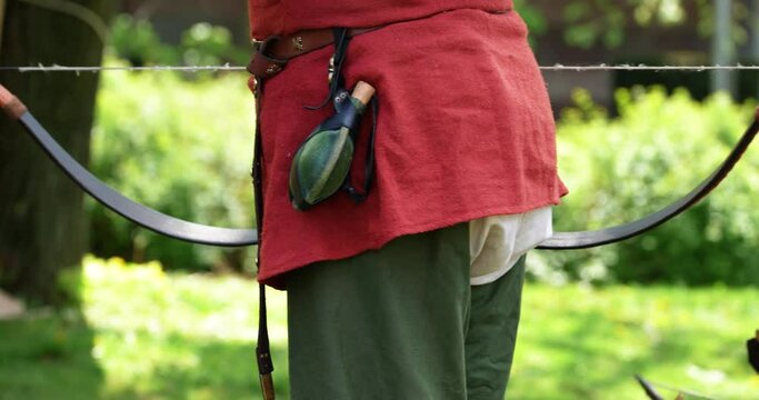 a soldier with a bow and arrow and various equipment