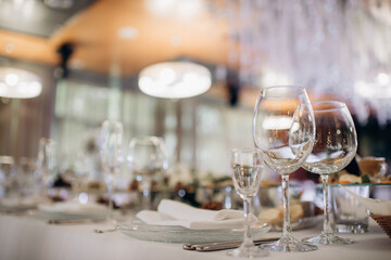 shining glasses in the wedding festive table setting side view