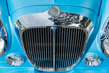 Close up view of chrome grille of exclusive vintage car, replica on the famous convertible car in...