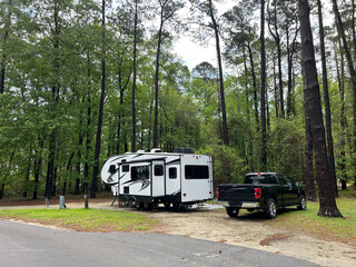 A fifth wheel rv set up for camping at the Santee State Park in South Carolina, USA. - obrazy, fototapety, plakaty