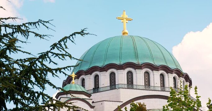 orthodox church in white marble stone and golden cross