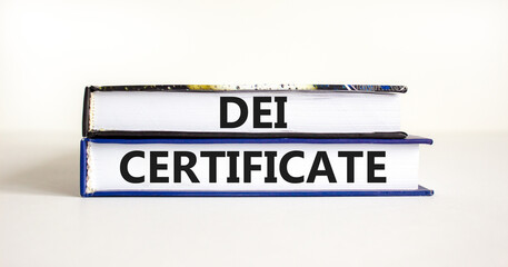 DEI diversity equity inclusion certificate symbol. Books with words DEI certificate on beautiful white background. Business DEI diversity equity inclusion certificate concept. Copy space.
