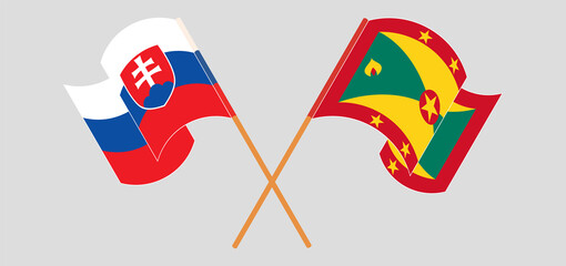 Crossed and waving flags of Slovakia and Grenada