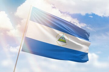 Sunny blue sky and a flagpole with the flag of nicaragua