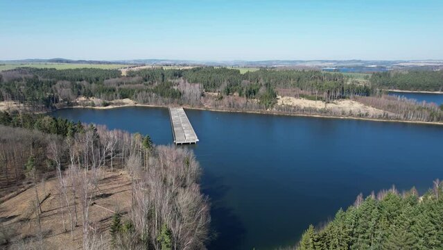 abandoned and unfinished highway bridges ending in the middle of a floded dam.Mosty protektor&aacute;tn&iacute; d&aacute;lnice. Czech republic, Europe panorama view