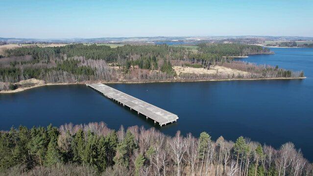 abandoned and unfinished highway bridges ending in the middle of a floded dam.Mosty protektor&aacute;tn&iacute; d&aacute;lnice. Czech republic, Europe panorama view