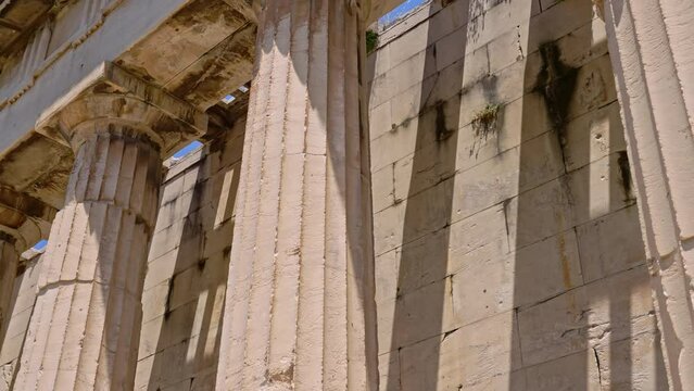 Moving a long a colonnade from the ancient Temple of Hephaestus in Ancient Agora, Athens, Greece