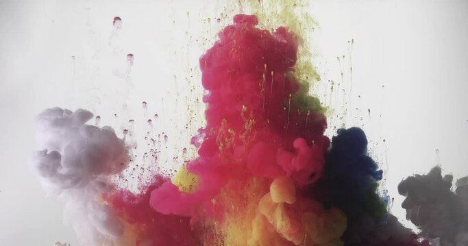 Colorful rainbow paint mixing in water on white background
