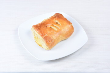 puff pastry multi-cheese cake on wooden background