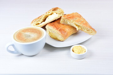 puff pastry multi-cheese cake on wooden background