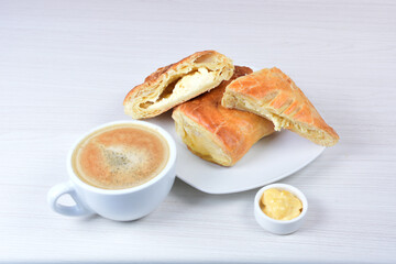 puff pastry multi-cheese cake on wooden background
