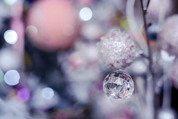 Crystal silver glitter ball Christmas bauble luxury decoration, pink and blue bokeh background