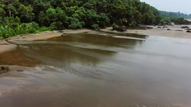 Choco Colombia. Aerial Drone Footage Of Wet Sandy Jungle Beach During Low Tide.