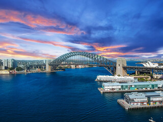 Naklejka premium Sydney Harbour Australia with nice colours in the sky. Nice blue water of the Harbour, high rise offices and residential buildings of the City in the background, NSW Australia