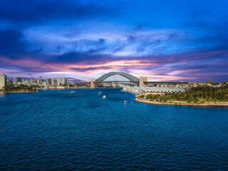 Sydney Harbour Australia with nice colours in the sky. Nice blue water of the Harbour, high rise offices and residential buildings of the City in the background, NSW Australia