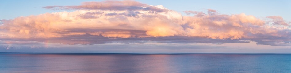 Naklejka na ściany i meble Panorama of Sunset Clouds over the Sea