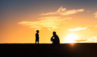 Father and son talking together. Fatherhood and parent child relationships 