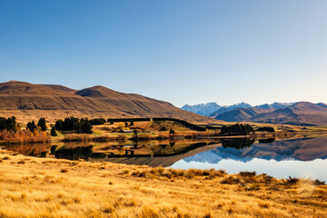 Reflections on the very calm Lake Clearwater in the Ashburton Lakes district