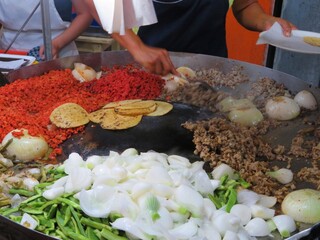 woman preparing traditional mexican dish-tacos