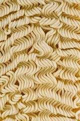Raw Instant noodles. Close up instant noodles texture for background and packing design.