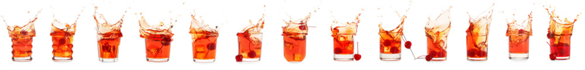 Glasses of tasty Manhattan cocktail with splashes on white background
