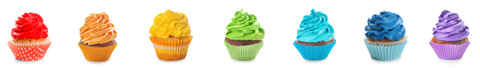 Set of colorful cupcakes on white background