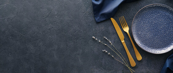 Beautiful table setting on dark background with space for text, top view