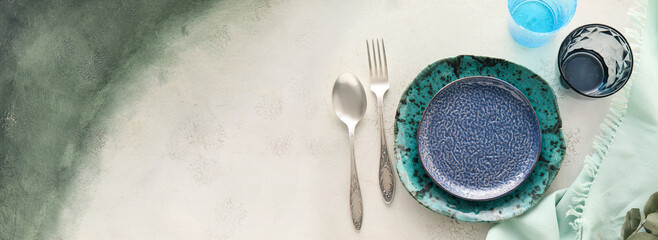 Beautiful simple table setting on light background with space for text, top view