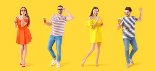 Fototapeta premium Set of happy people with beer and cocktails on yellow background