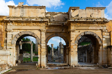 Fototapeta na wymiar Ruins of Gate of Augustus located at Curetes Street in the Celsus Library Court in Ephesus, Turkey