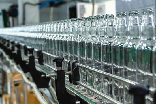 Row of glass bottles to fill with expensive alcohol drinks