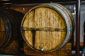 Wooden cask to make luxury alcohol drinks stand in cellar