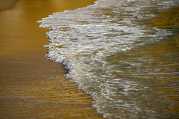 Panorama of ocean waves on a tropical sea with deep blue wawes, sea foam. Calm sea water, ocean...