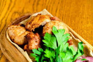 Chicken, Salmon and Meat Shish Kebabs on Parchment with Sauces Top View