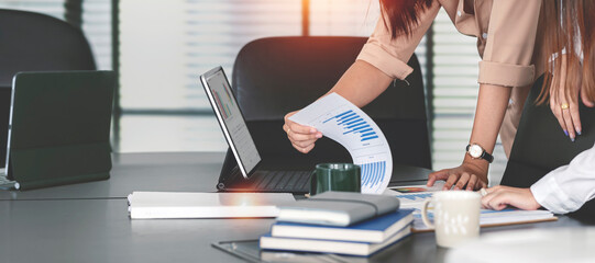 Business people team working at office with tablet and document, doing planning analyzing the financial report, business plan investment, finance analysis concept. Economic business discussions.