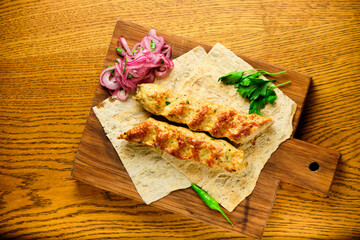 Juicy toasted kebab gyroscopic sausage Lyulya Minced