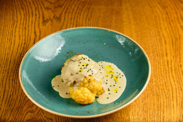 Sésamo Risotto on a white restaurant plate.