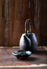 Traditional, handcrafted ceramic on dark wooden background. Soft focus. Close up.