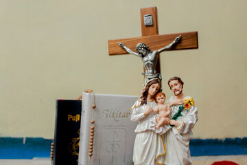 Salatiga, Indonesia-April 17 2022: close up photo of statues of maryam and jesus with bible.